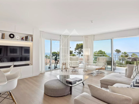 Interior of a modern apartment in Cannes with sea view, elegant and bright furnishings.