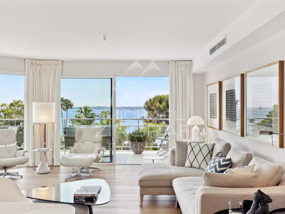Interior of a modern apartment with sea view, elegant furniture and refined decoration.