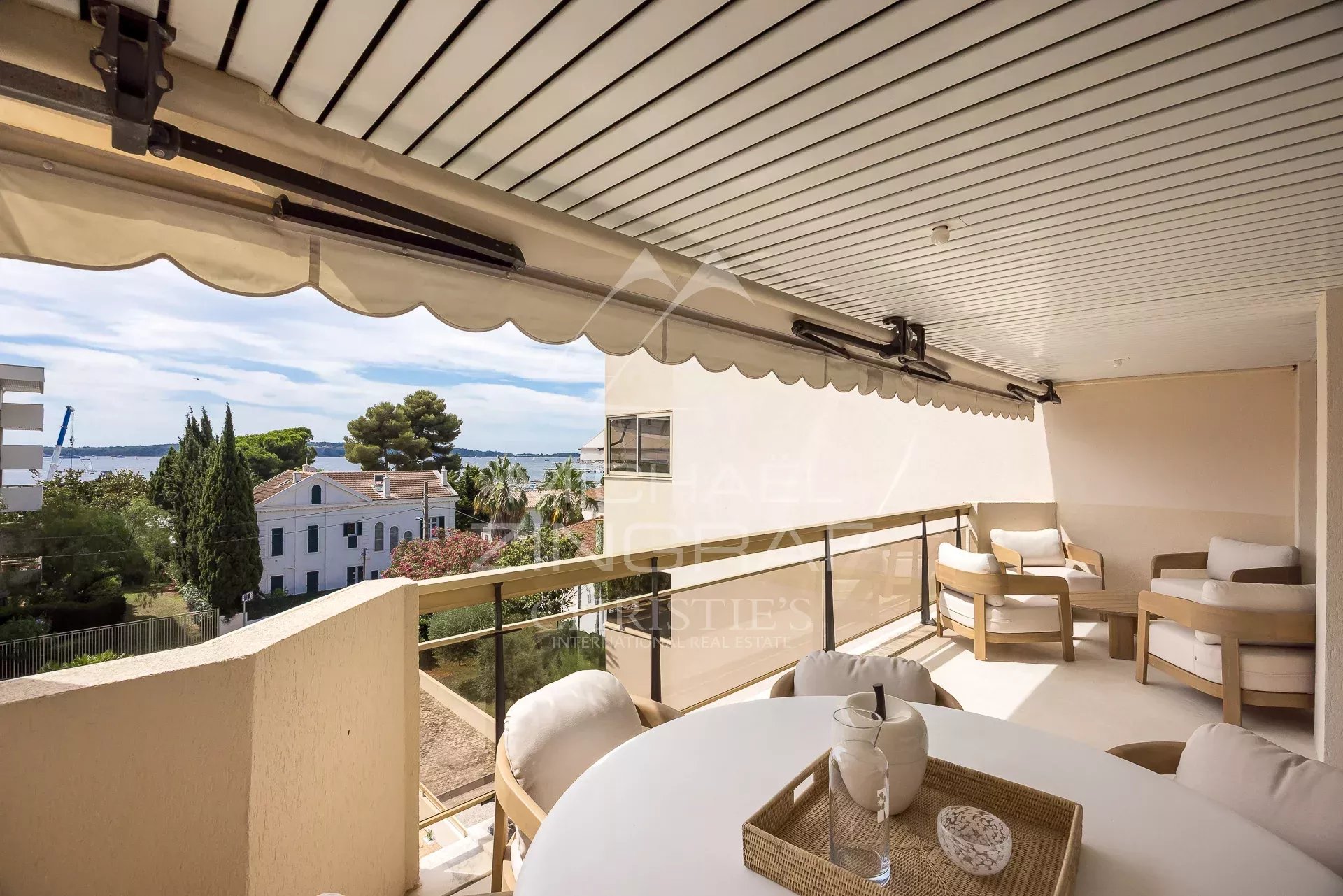 Balcony with sea view in Cannes Balcony of an apartment in Cannes with sea view and outdoor furniture
