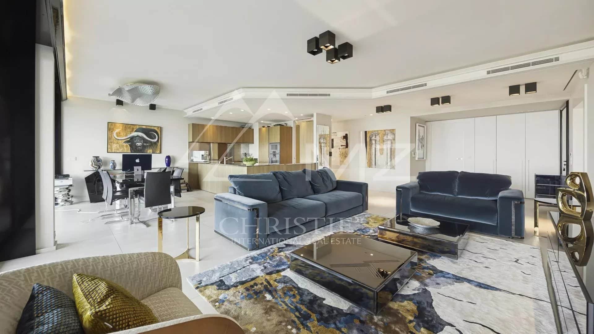 Modern living room in a contemporary apartment with designer furniture and minimalist decor.