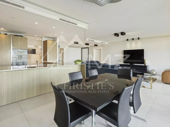Interior of a contemporary apartment with open kitchen and dining room in Cannes.