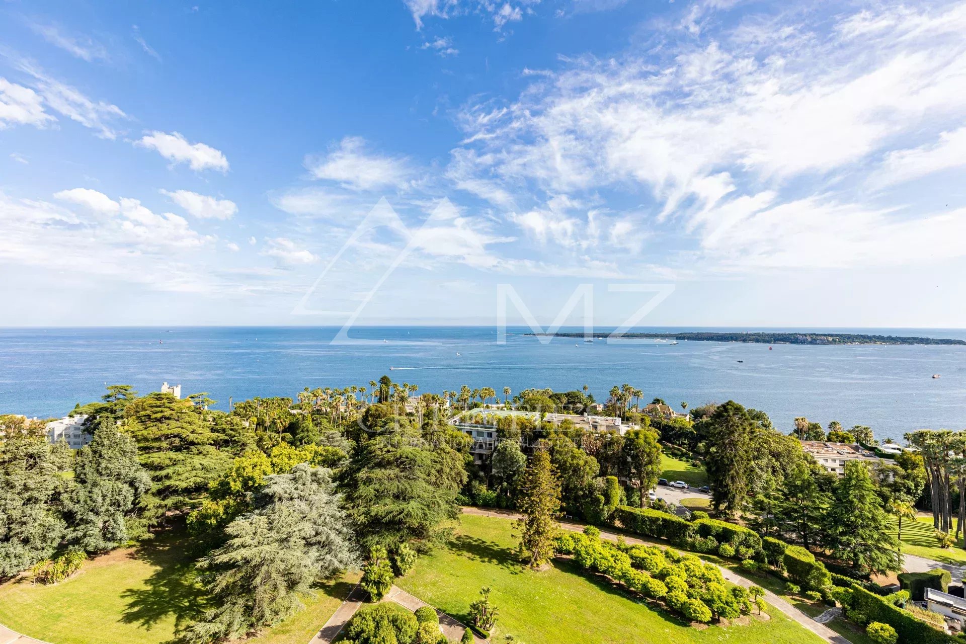 Panoramic sea view from a penthouse in Cannes, with gardens in the foreground.