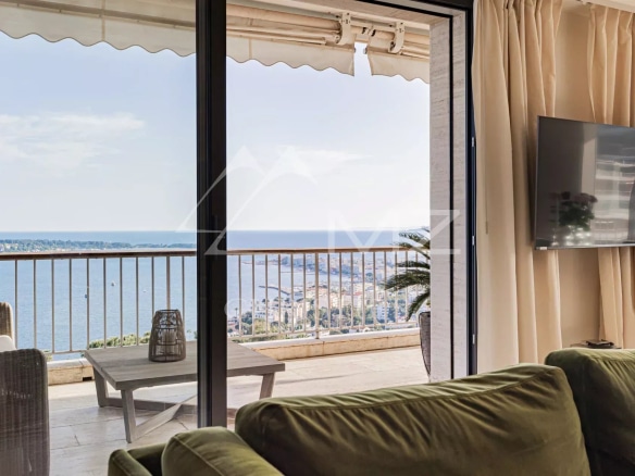 Panoramic sea view from a penthouse in Cannes, with a bright and modern living room.