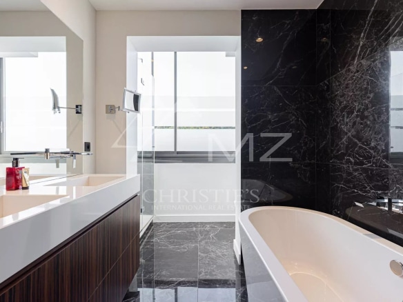 Modern bathroom with bathtub and sink in a penthouse in Cannes.