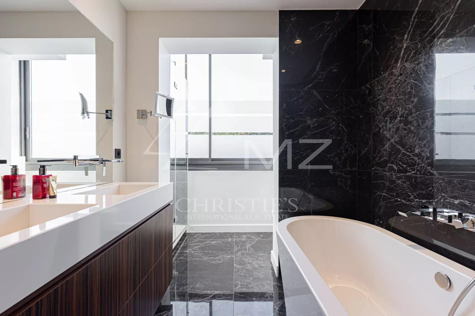 Modern bathroom with bathtub and sink in a penthouse in Cannes.