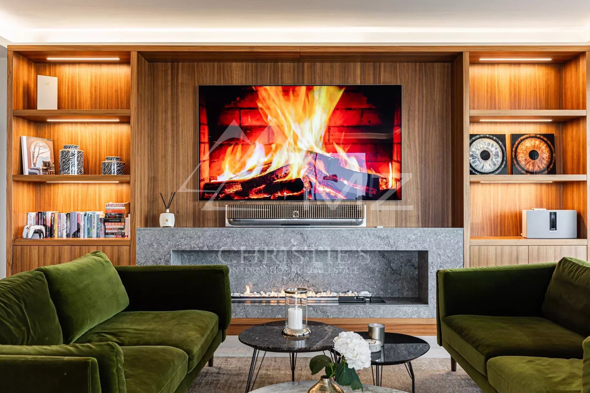 Interior of a penthouse with a modern living room, fireplace and television, Cannes