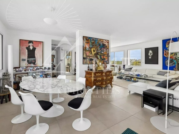 Interior of a rooftop villa in Cannes with a bright living room and modern decor.