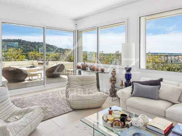 Interior of a rooftop villa in Cannes with views of the hills and the sea.