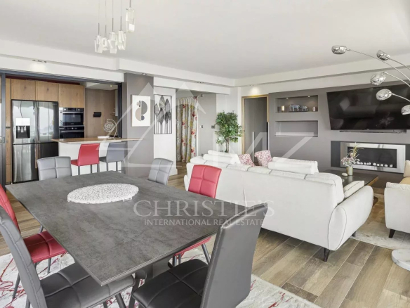 Interior of a modern apartment with living room, dining room and open kitchen in Cannes.