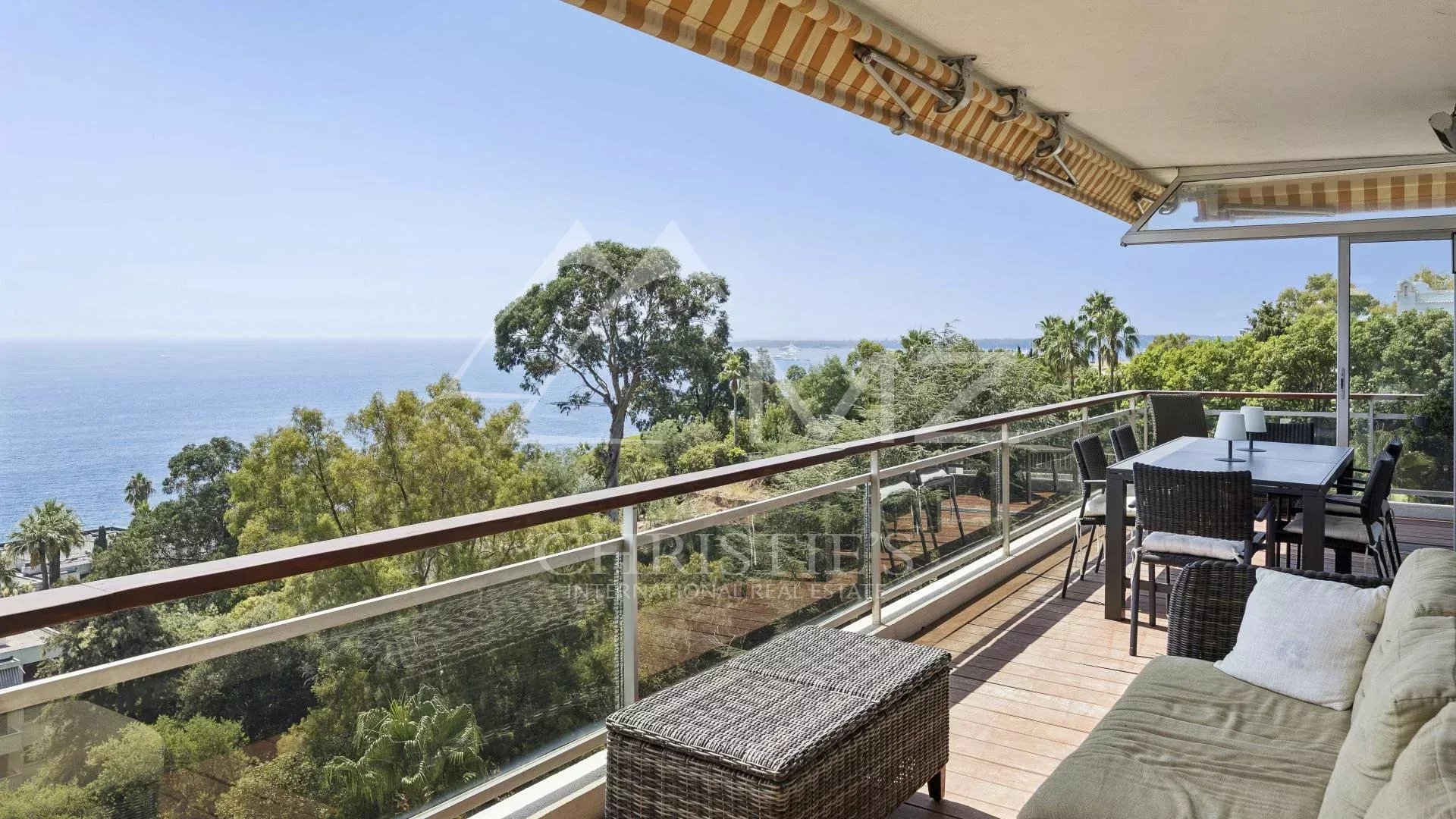 Apartment terrace with sea view and outdoor furniture in Cannes.
