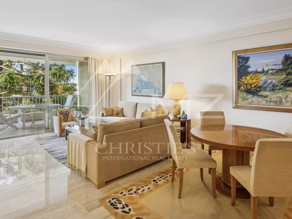 Interior of a contemporary apartment in Cannes with living room and dining room.