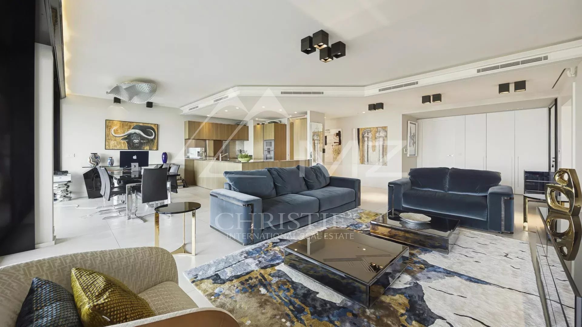 Contemporary apartment in Cannes Modern living room of a contemporary apartment in Cannes, with elegant furniture and minimalist decor.