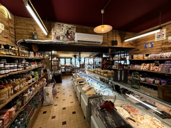 Interior of a grocery store with shelves of food and beverage products.