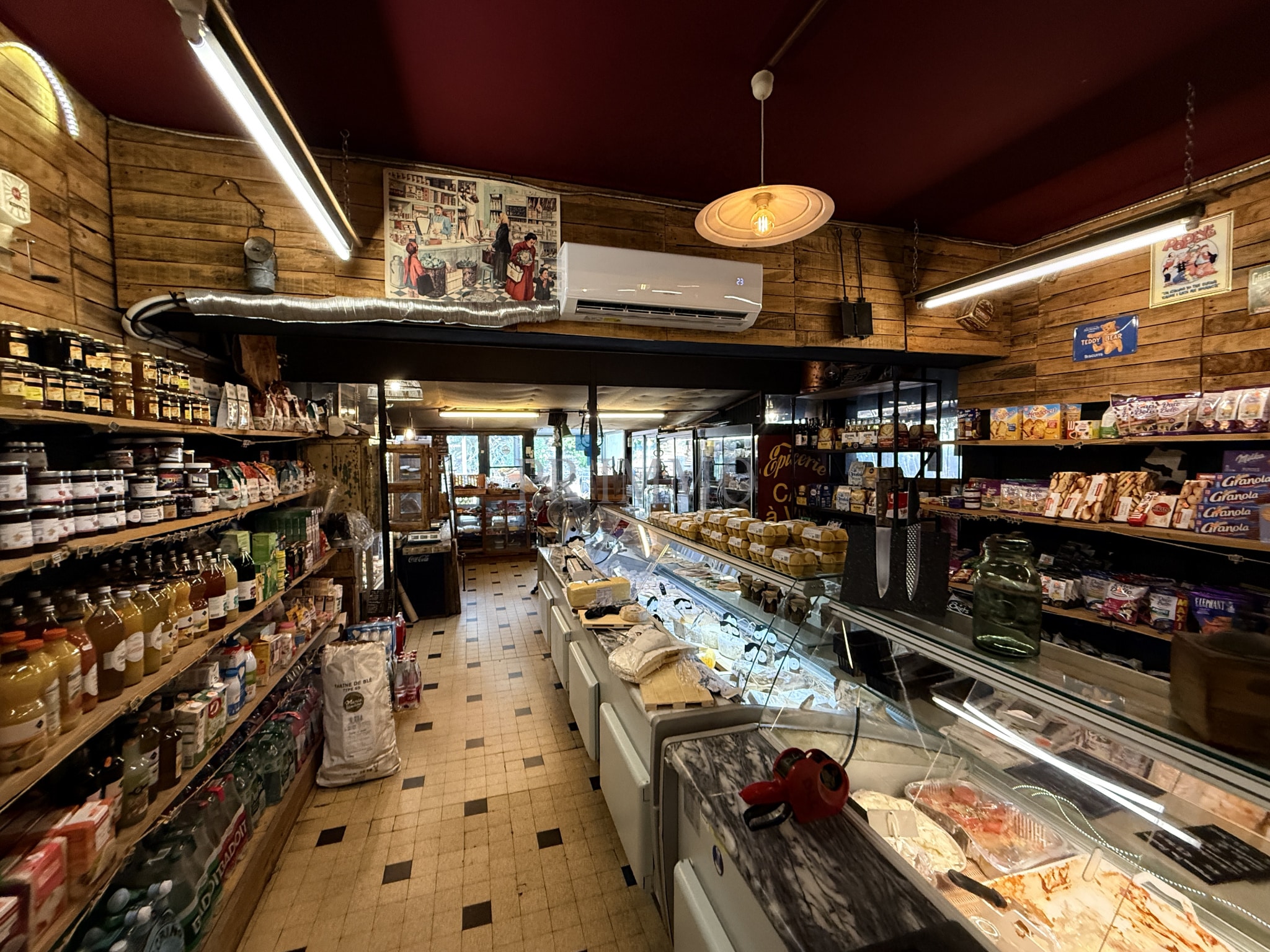 Grocery store integrated into a house Interior of a grocery store with shelves of food and beverage products.