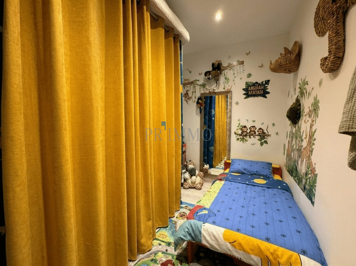 Room with animal decorations Colorful bedroom with a single bed and animal-themed wall decorations.