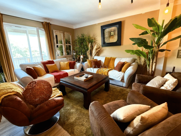 Spacious living room with sofas and warm interior decor.
