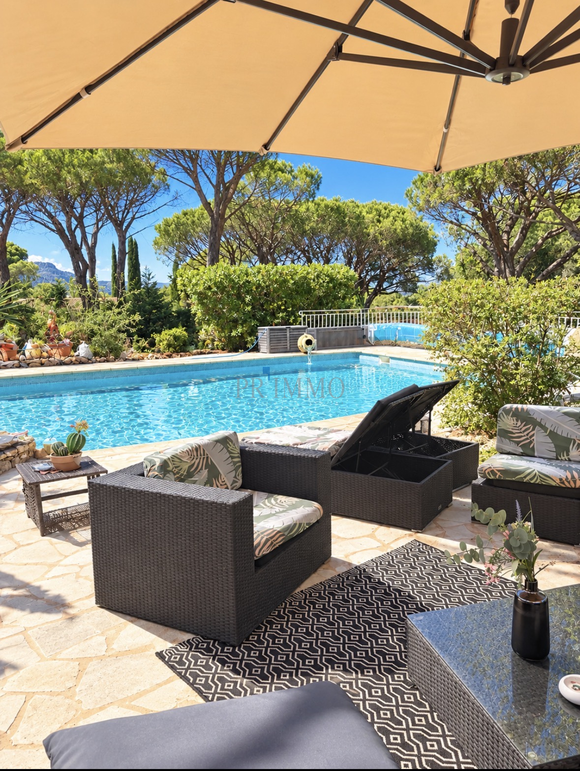 Terrace with swimming pool in Vidauban Terrace with garden furniture and swimming pool, surrounded by pine trees in a villa in Vidauban.