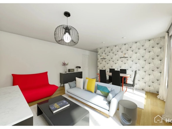 Salon lumineux d'un appartement de 62 m2 à Paris, avec canapé, table à manger et décoration moderne.