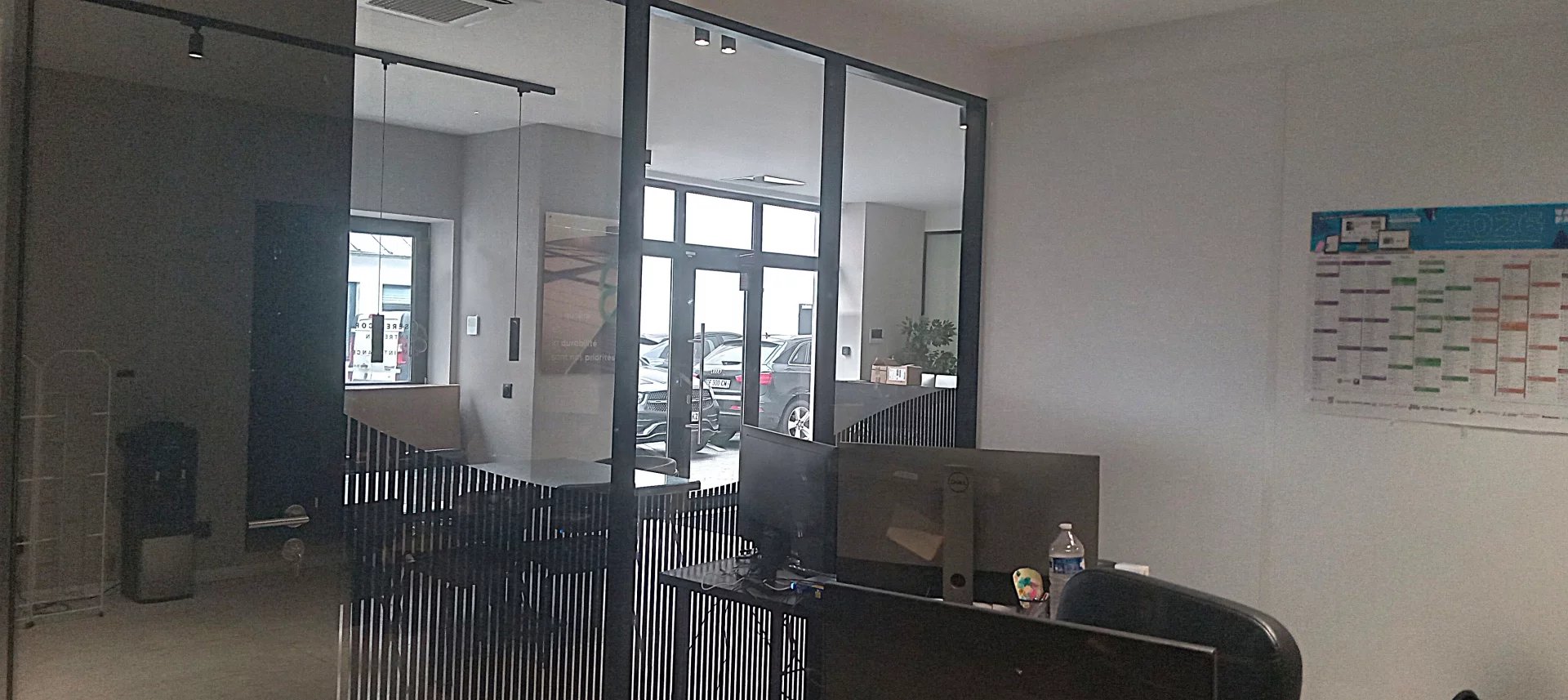 Modern office in Choisy-le-Roi Interior of a modern office with glass walls and a workspace.