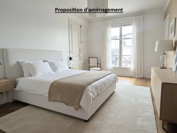 Chambre d'appartement à Paris 17ème avec lit, meubles modernes et lumière naturelle.