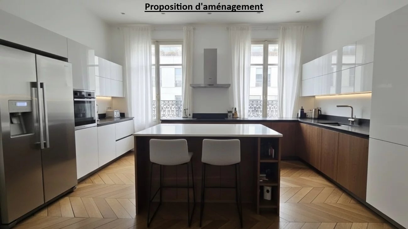 Cuisine d’un appartement familial à Paris 17ème Cuisine moderne avec îlot central et grandes fenêtres dans un appartement à Paris 17ème.
