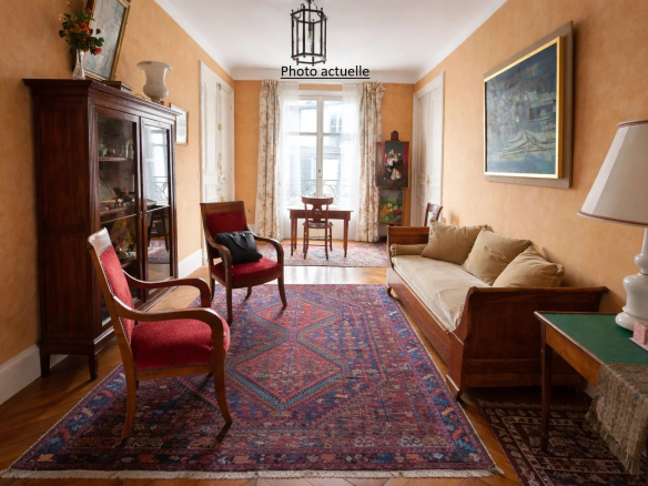 Intérieur d'un appartement familial à Paris 17ème, avec salon, tapis et mobilier en bois.