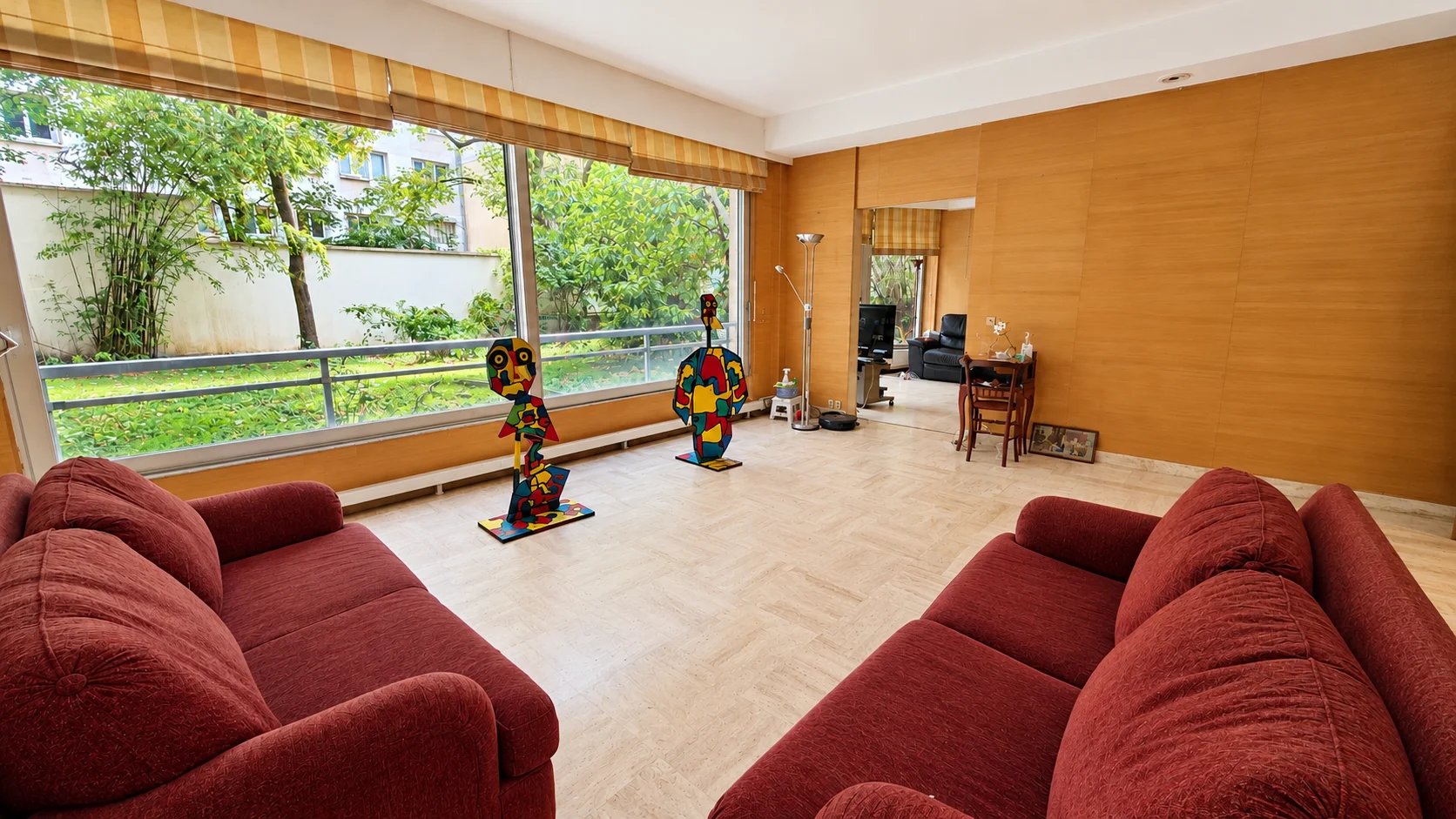 Family apartment in the 16th arrondissement of Paris Spacious living room of a family apartment in the 16th arrondissement of Paris with two private gardens.