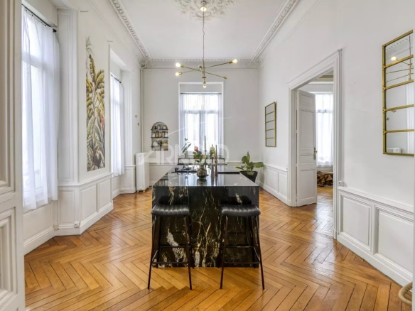 Interior of a private mansion in Ancenis with a marble counter and wooden parquet flooring