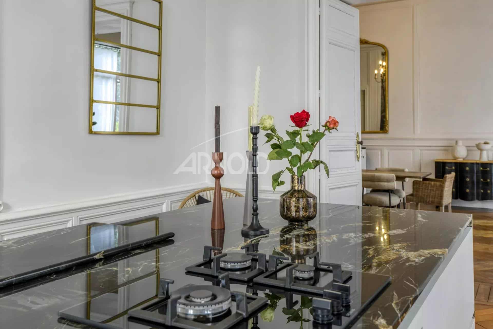 Interior of a private mansion in Ancenis with modern kitchen and contemporary decorative elements.