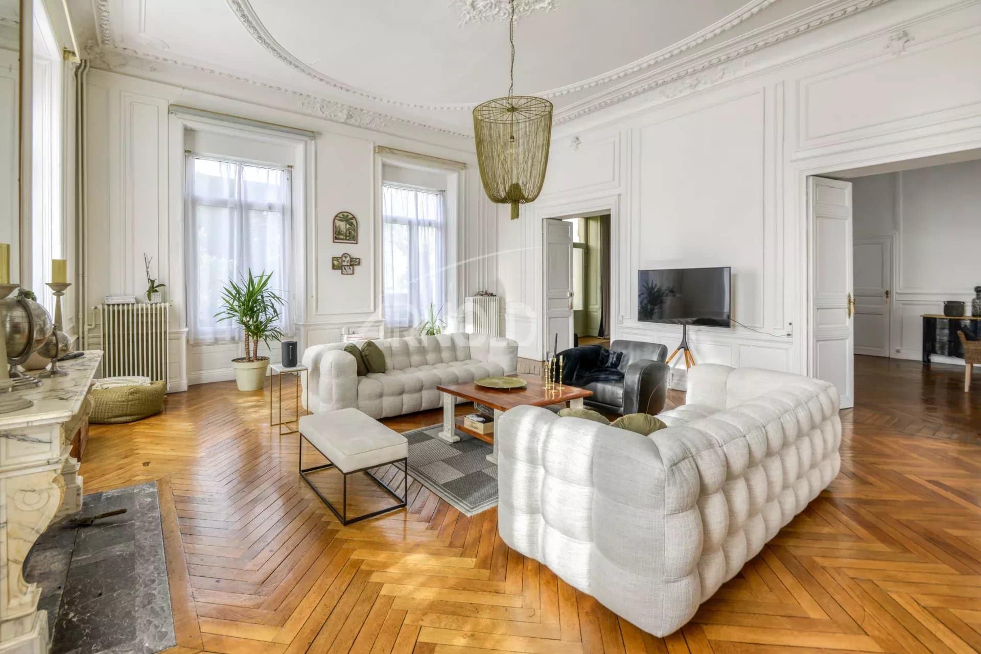 Interior of a private mansion in Ancenis with a bright living room and contemporary furniture.