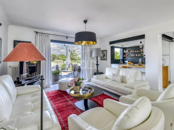 Interior of a renovated house with a bright living room and a view of nature.