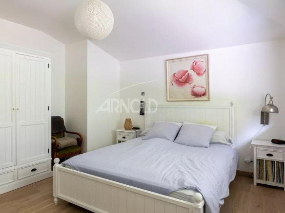 Bedroom in a contemporary house with a double bed and simple decor.