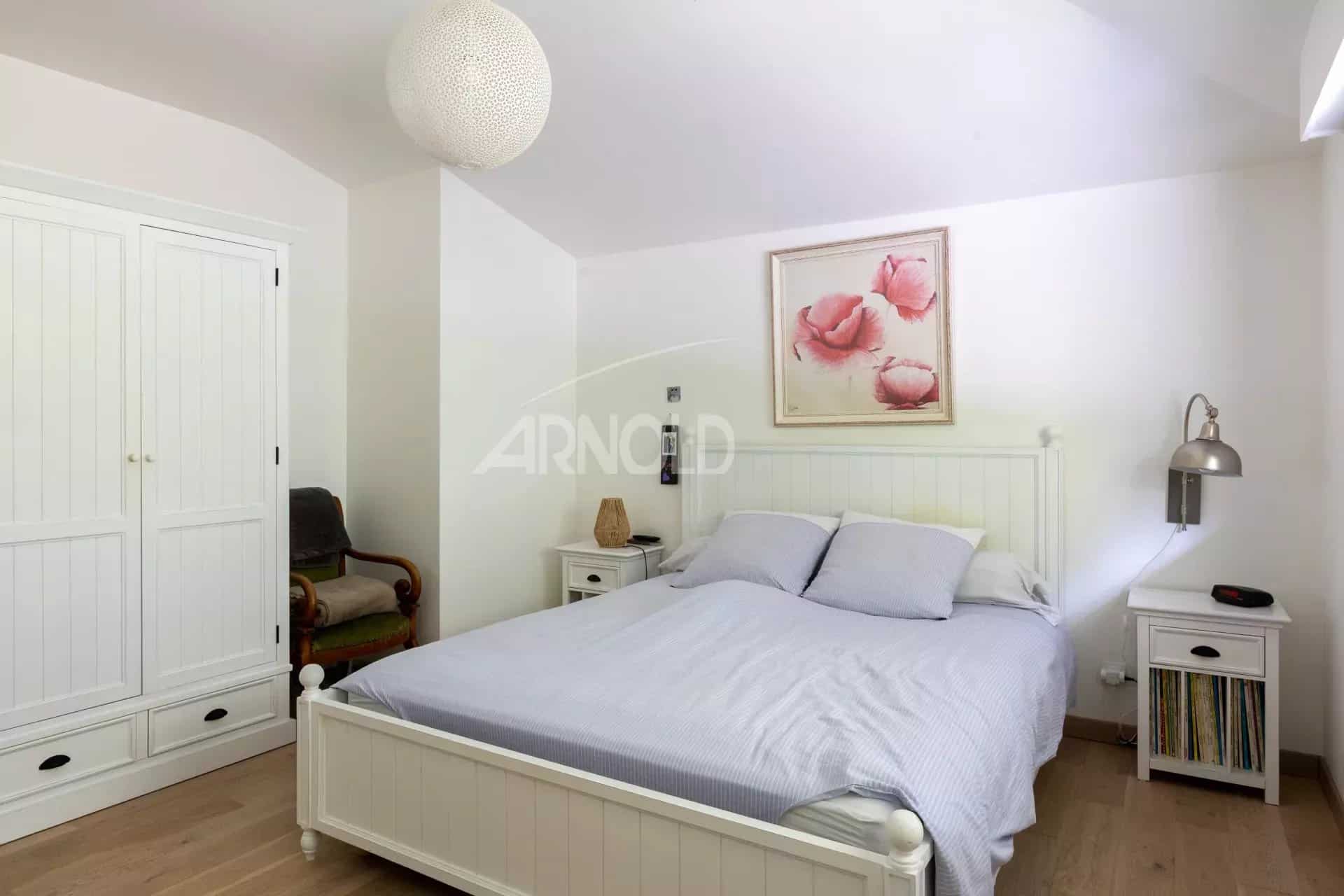 Bedroom in a contemporary house with a double bed and simple decor.