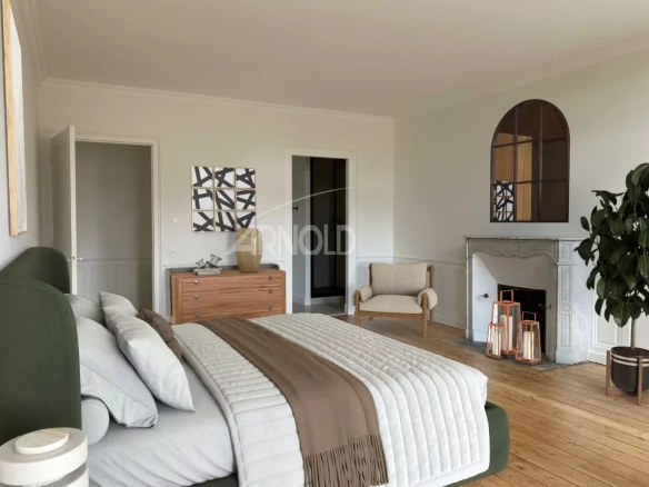 Spacious room with modern decor and fireplace in an apartment in Vannes.