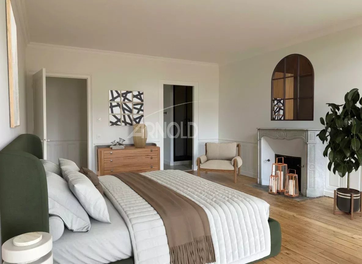 Spacious room with modern decor and fireplace in an apartment in Vannes.