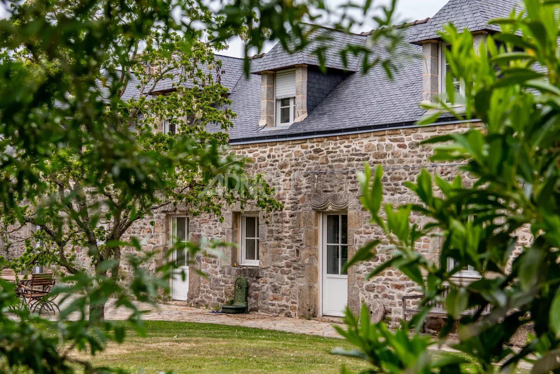 Stone farmhouse with swimming pool in Baden Stone farmhouse with swimming pool, wooded garden and countryside views in Baden.