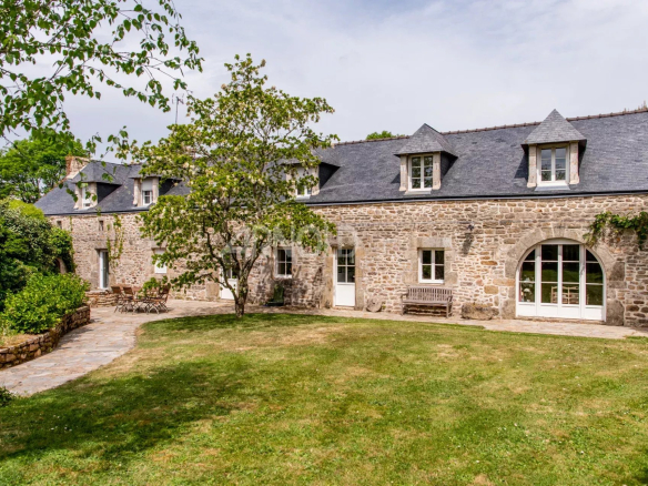 Stone farmhouse with garden and swimming pool, located in Baden, surrounded by wooded grounds.