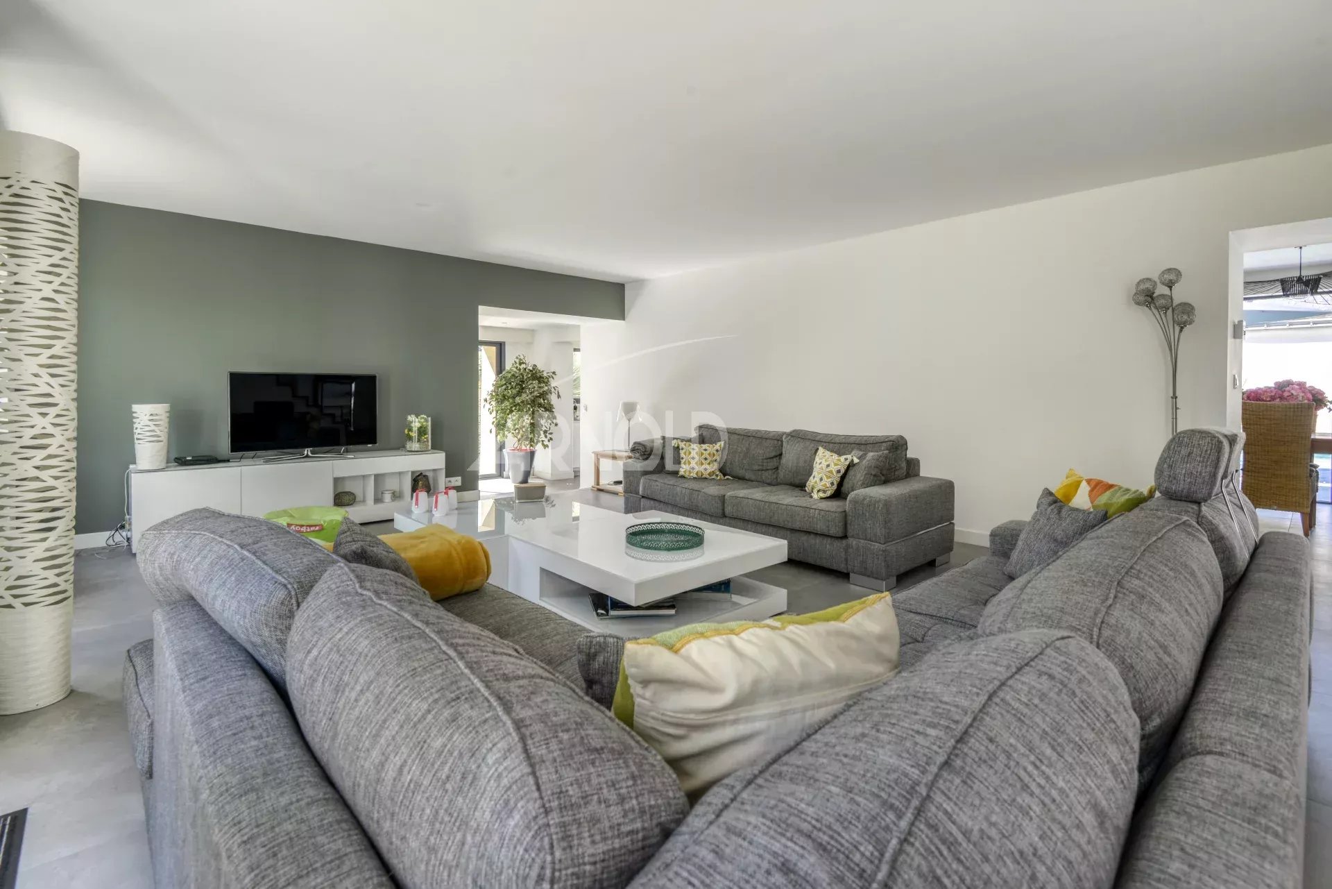 Living room of a house in Nantes Interior of a house in Nantes with a spacious living room and a modern sofa.