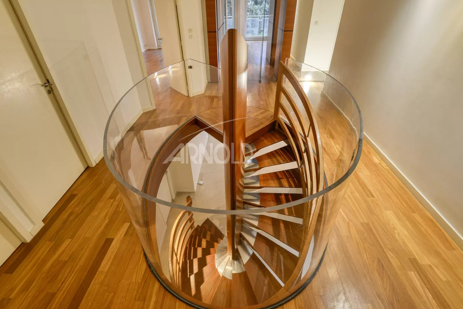 Spiral staircase Spiral staircase made of wood and glass in a modern apartment.