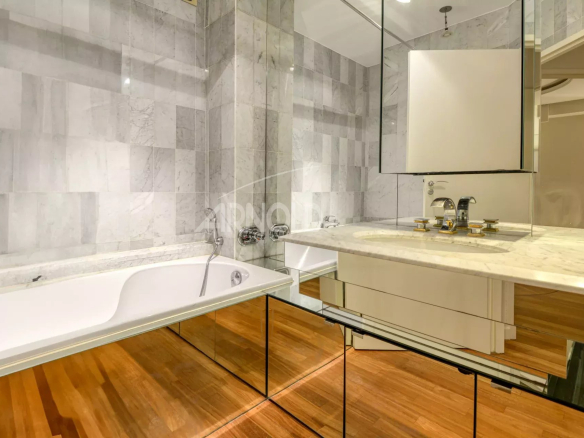 Modern bathroom with bathtub and marble vanity