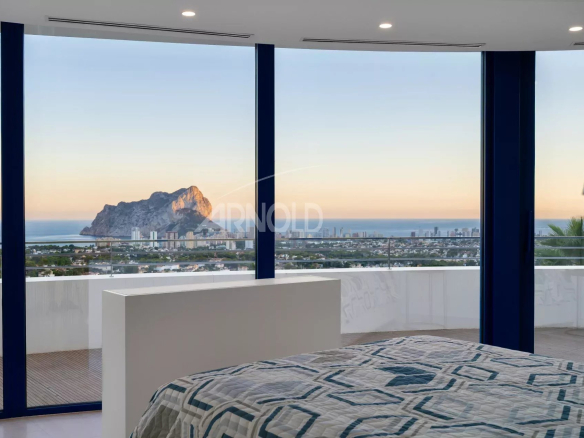 View from a bedroom in a modern villa overlooking the sea and the Penyal d'Ifac in Calpe.