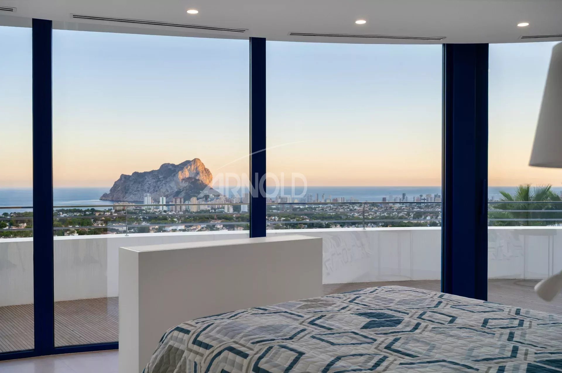 View from a bedroom in a modern villa overlooking the sea and the Penyal d'Ifac in Calpe.