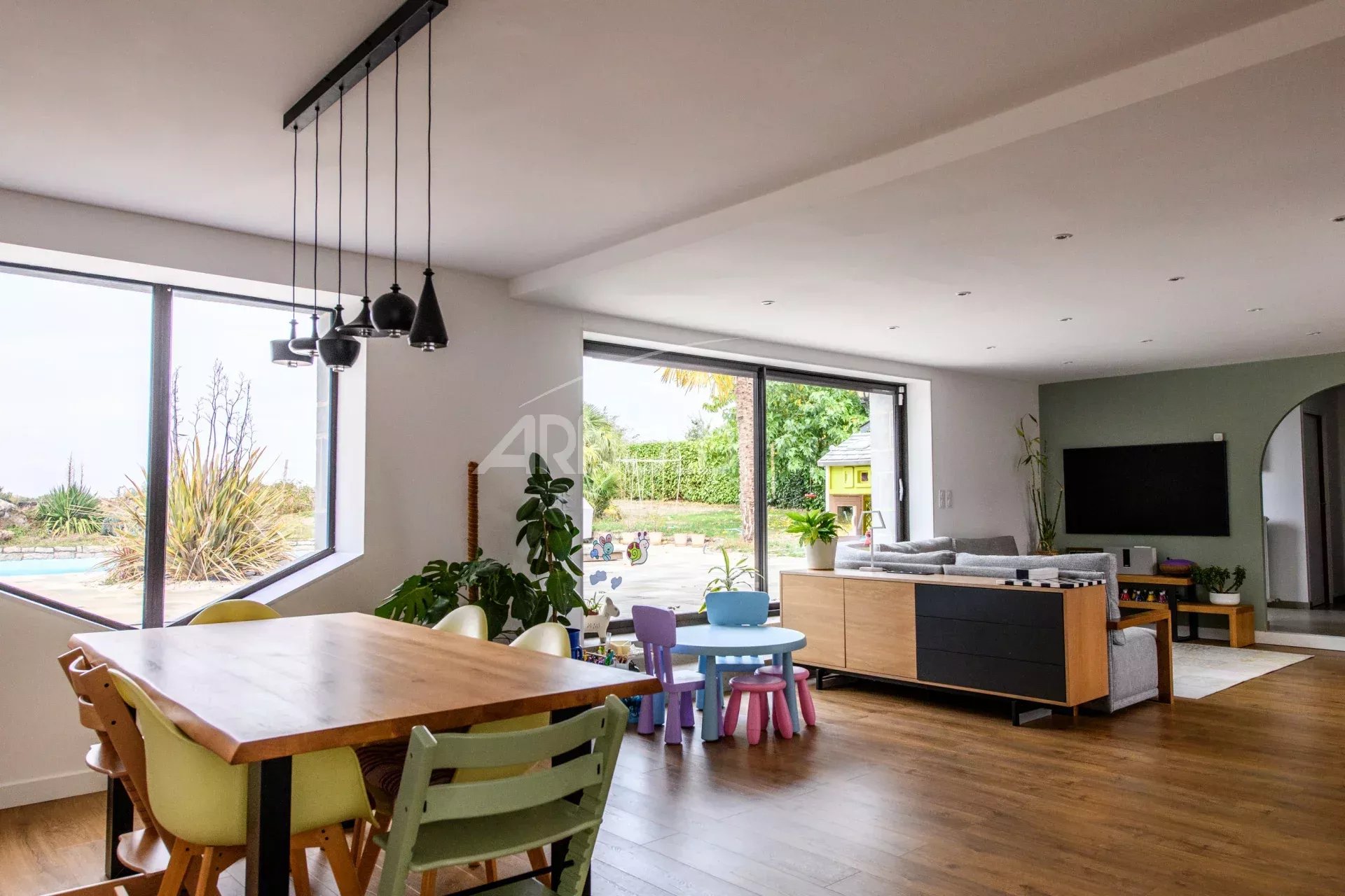 Interior of a contemporary farmhouse Interior of a contemporary farmhouse with dining room and pool view