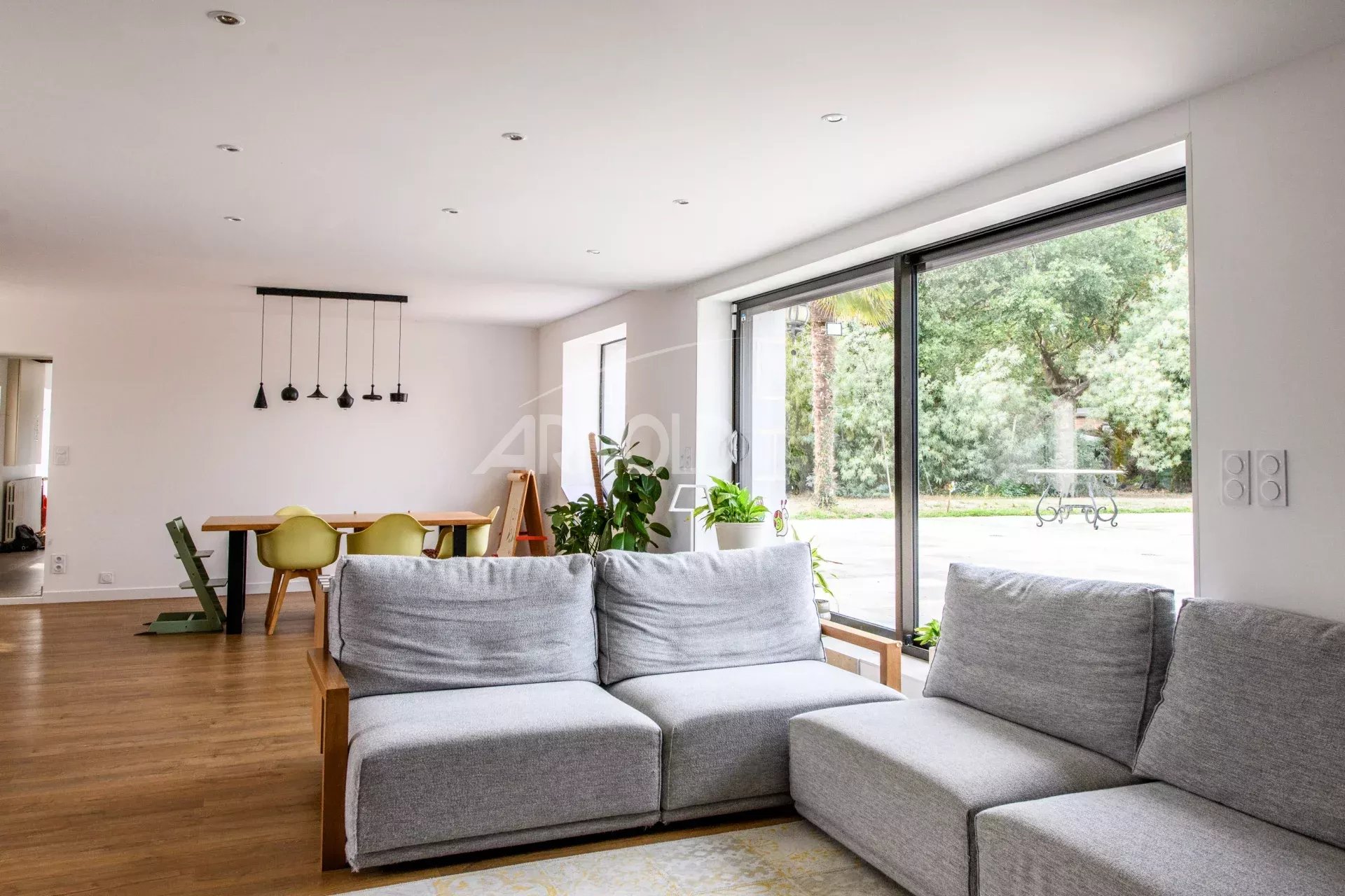 Interior of a contemporary farmhouse Interior of a contemporary farmhouse with a bright living room and dining area.