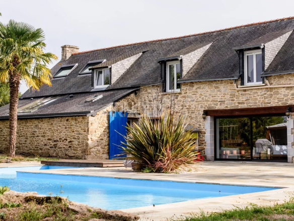 Contemporary stone farmhouse with swimming pool and landscaped garden in Surzur.