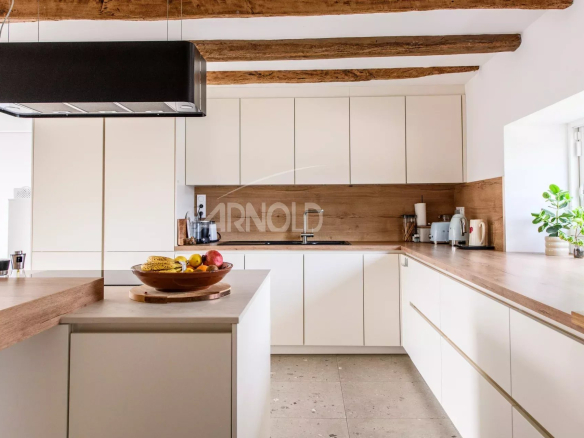 Modern and spacious kitchen in a contemporary farmhouse with exposed beams