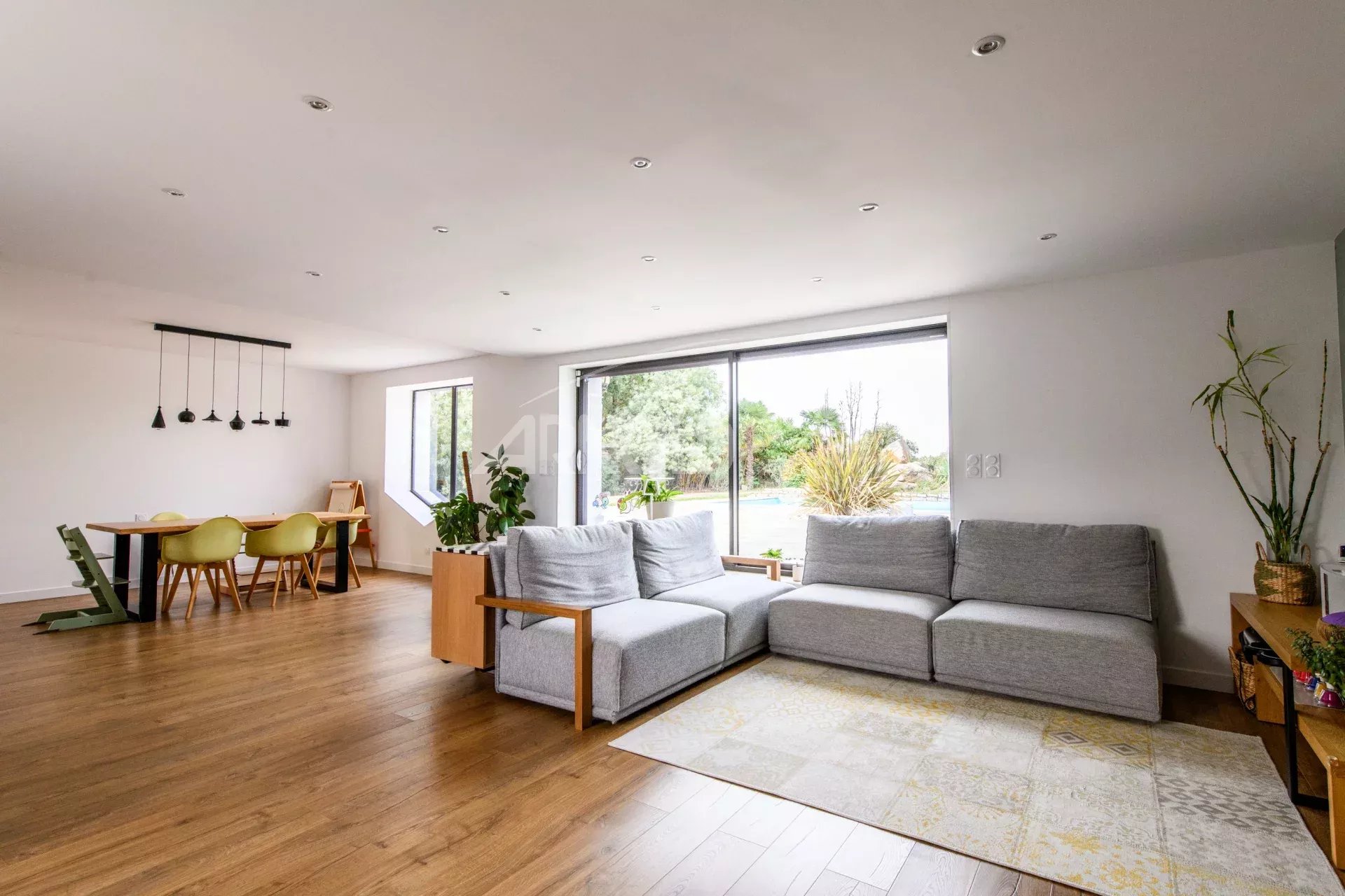 Interior of a contemporary farmhouse Interior of a contemporary farmhouse with a spacious living room and garden view.