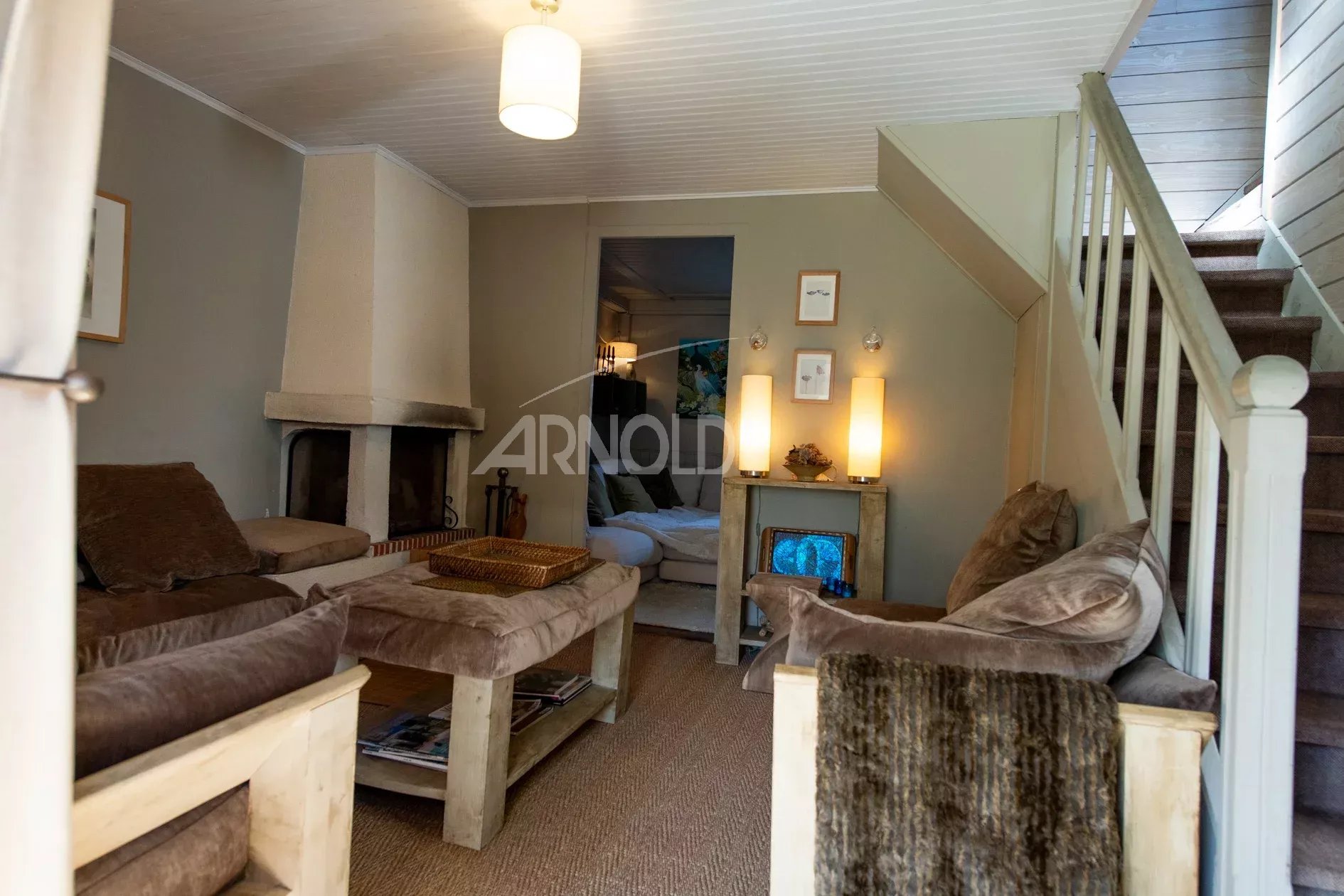 Intérieur d’une maison à Belz Intérieur d'une maison de charme à Belz, avec salon confortable et cheminée.