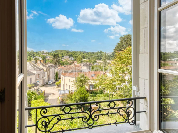 View from a window of the Exceptional Priory in Rocheservière, showing the surrounding town.