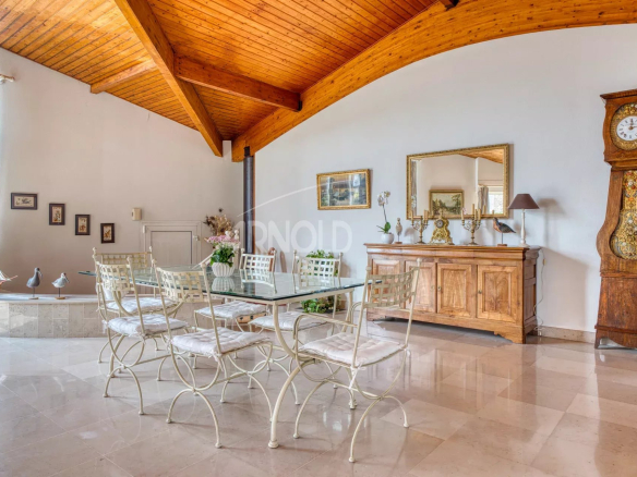 Interior of a house with a bright dining room and wooden furniture in Saint-Gilles-Croix-de-Vie.